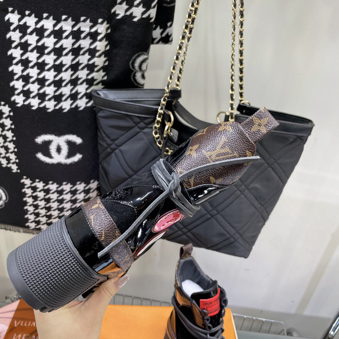 LAUREATE PLATFORM BOOTS IN BLACK SUEDE AND CHOCOLATE BROWN MONOGRAM CALFSKIN