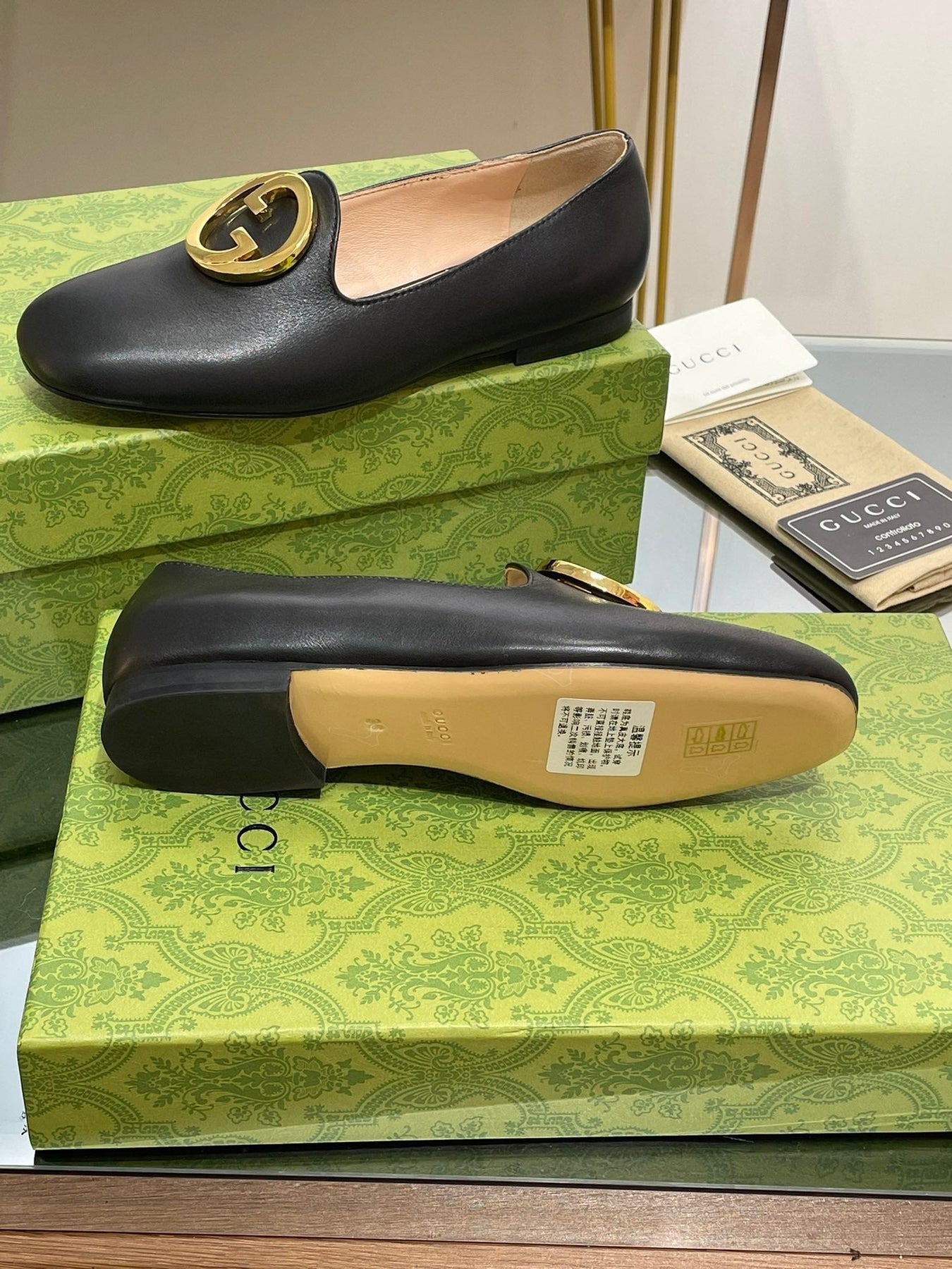 BLONDIE LOGO-PLAQUE LOAFERS IN BLACK CALFSKIN WITH GOLD HARDWARE