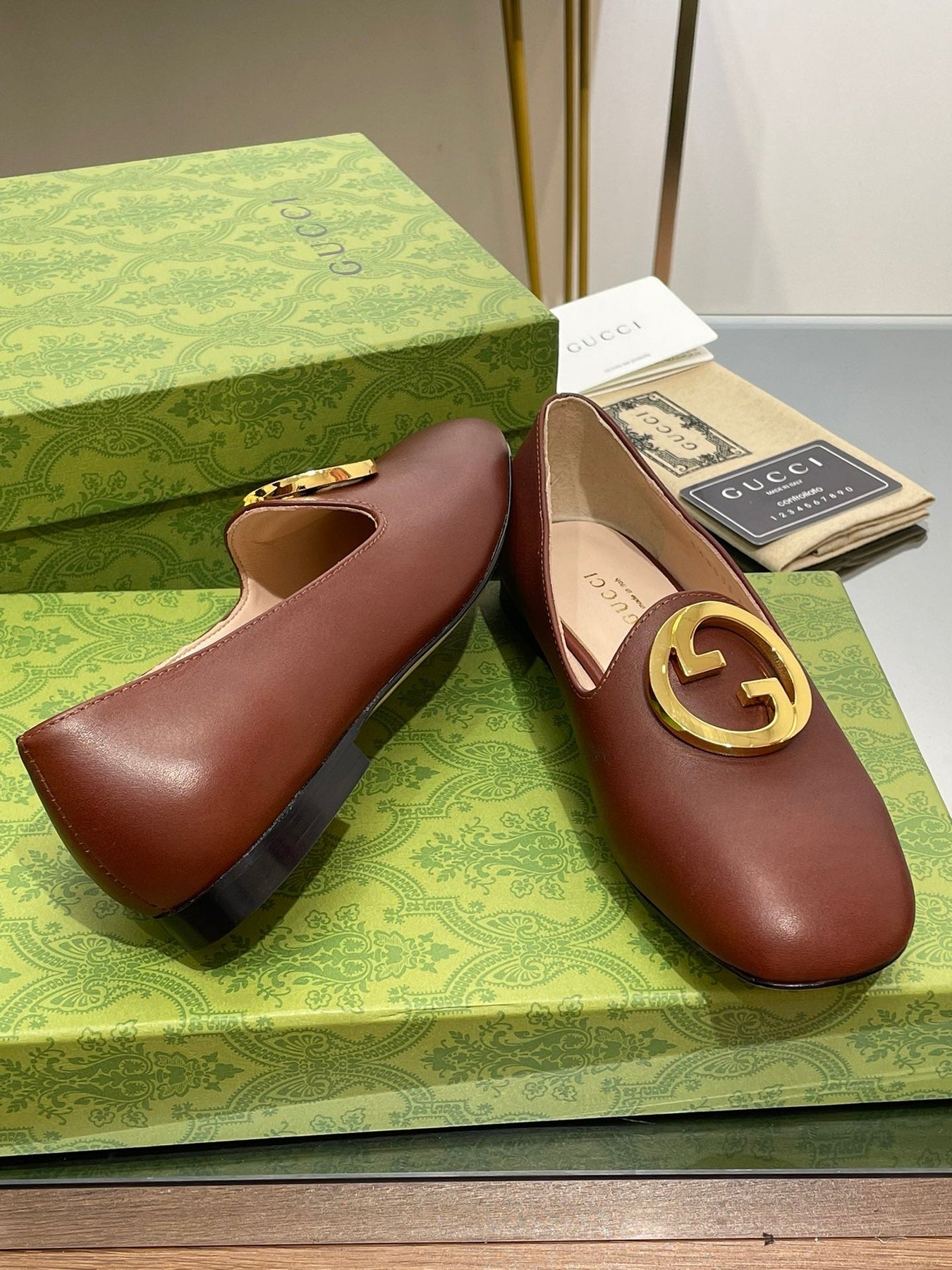 BLONDIE LOGO-PLAQUE LOAFERS IN SYRUP BROWN CALFSKIN WITH GOLD HARDWARE