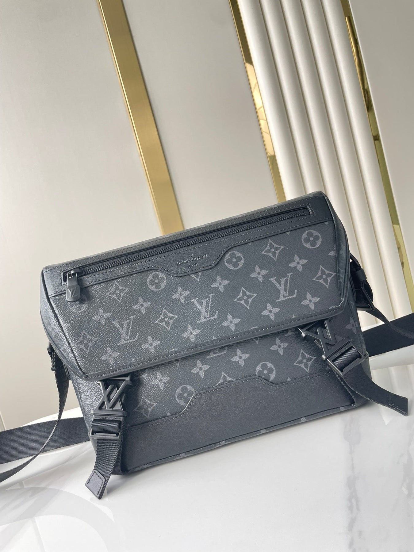 MESSENGER VOYAGER PM 33 IN GUN METAL MONOGRAM ECLIPSE CANVAS