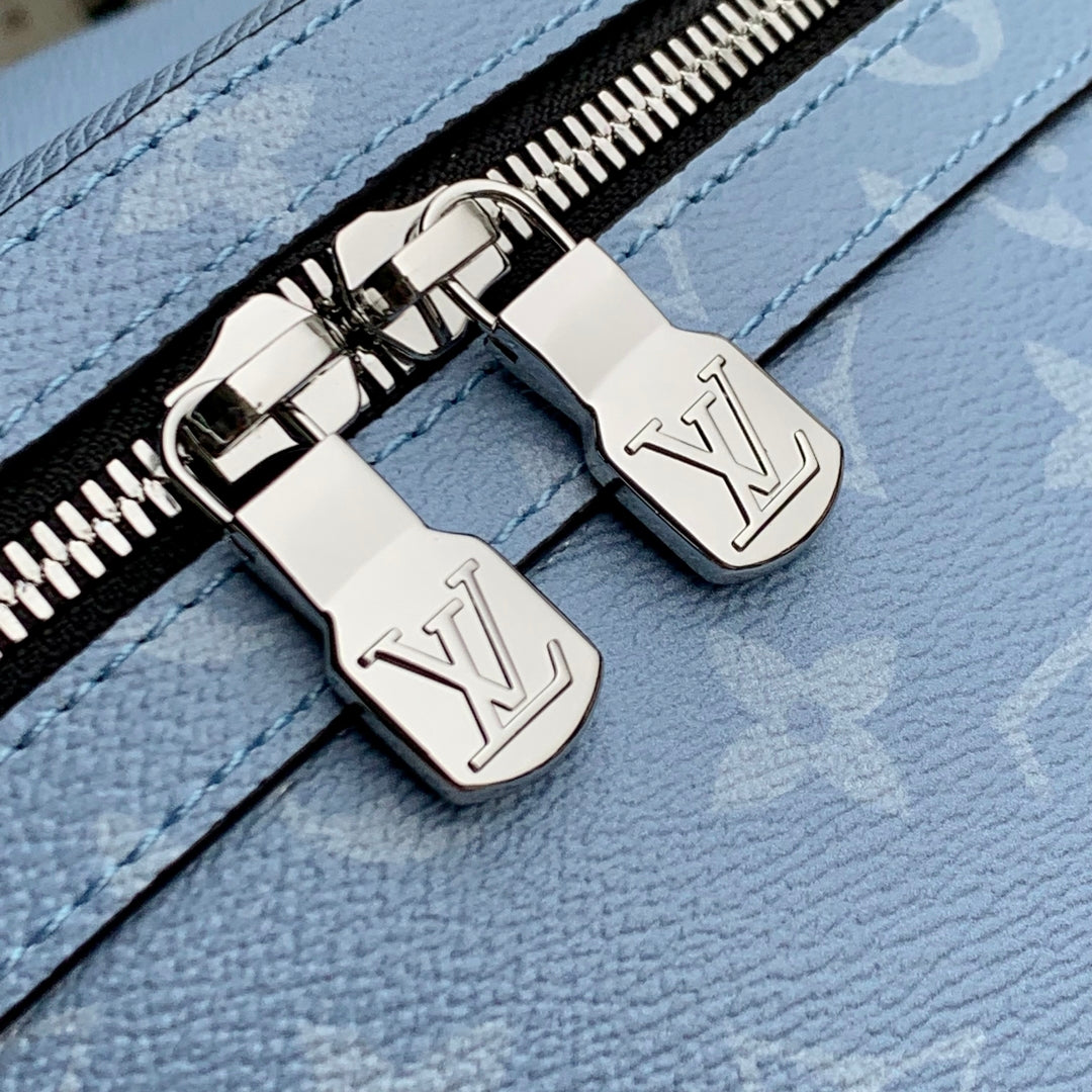 DISCOVERY SLIM BACKPACK 38 BLUE MONOGRAM COATED CANVAS AND CALFSKIN