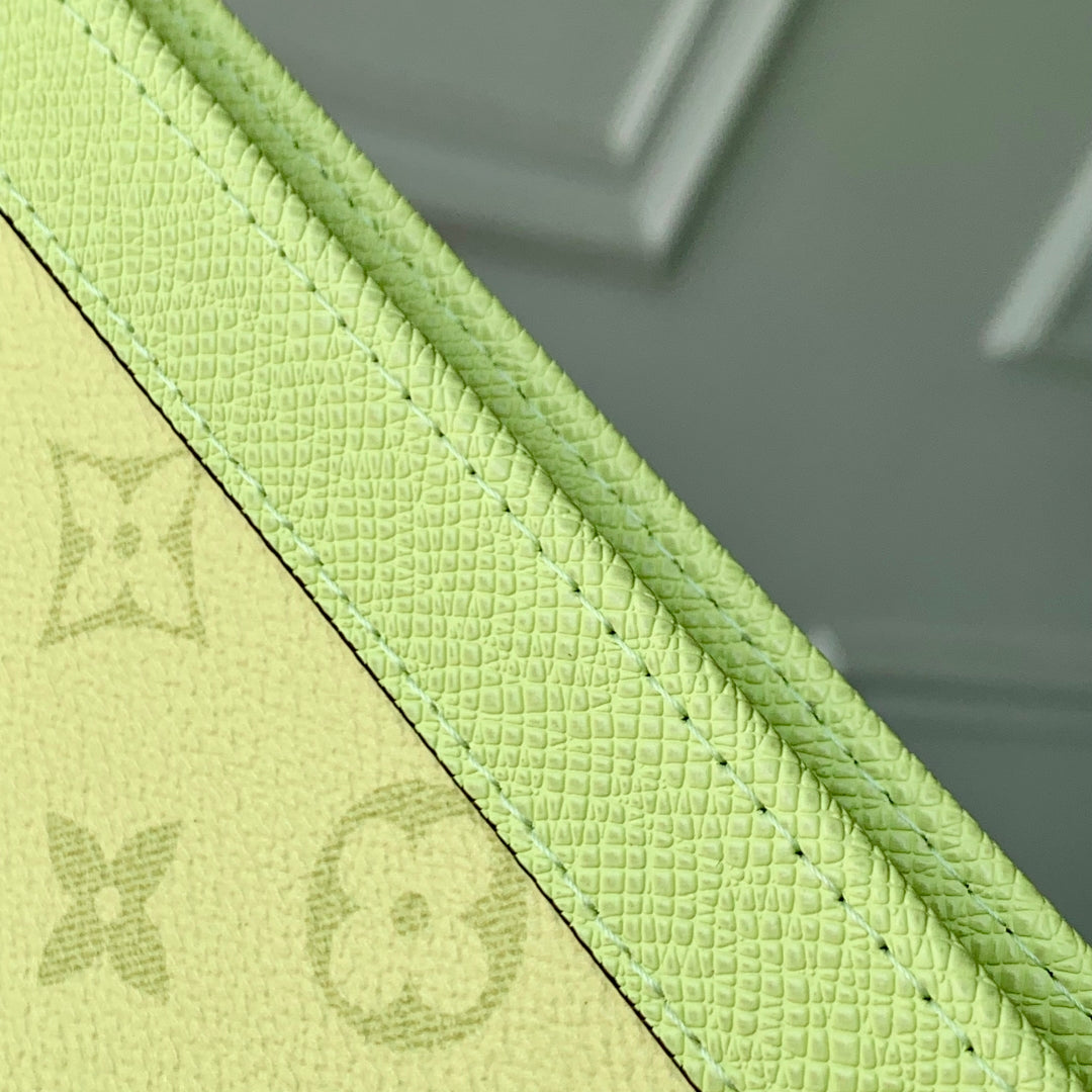 POCHETTE VOYAGE 26 IN LEMON YELLOW MONOGRAM ECLIPSE CALFSKIN