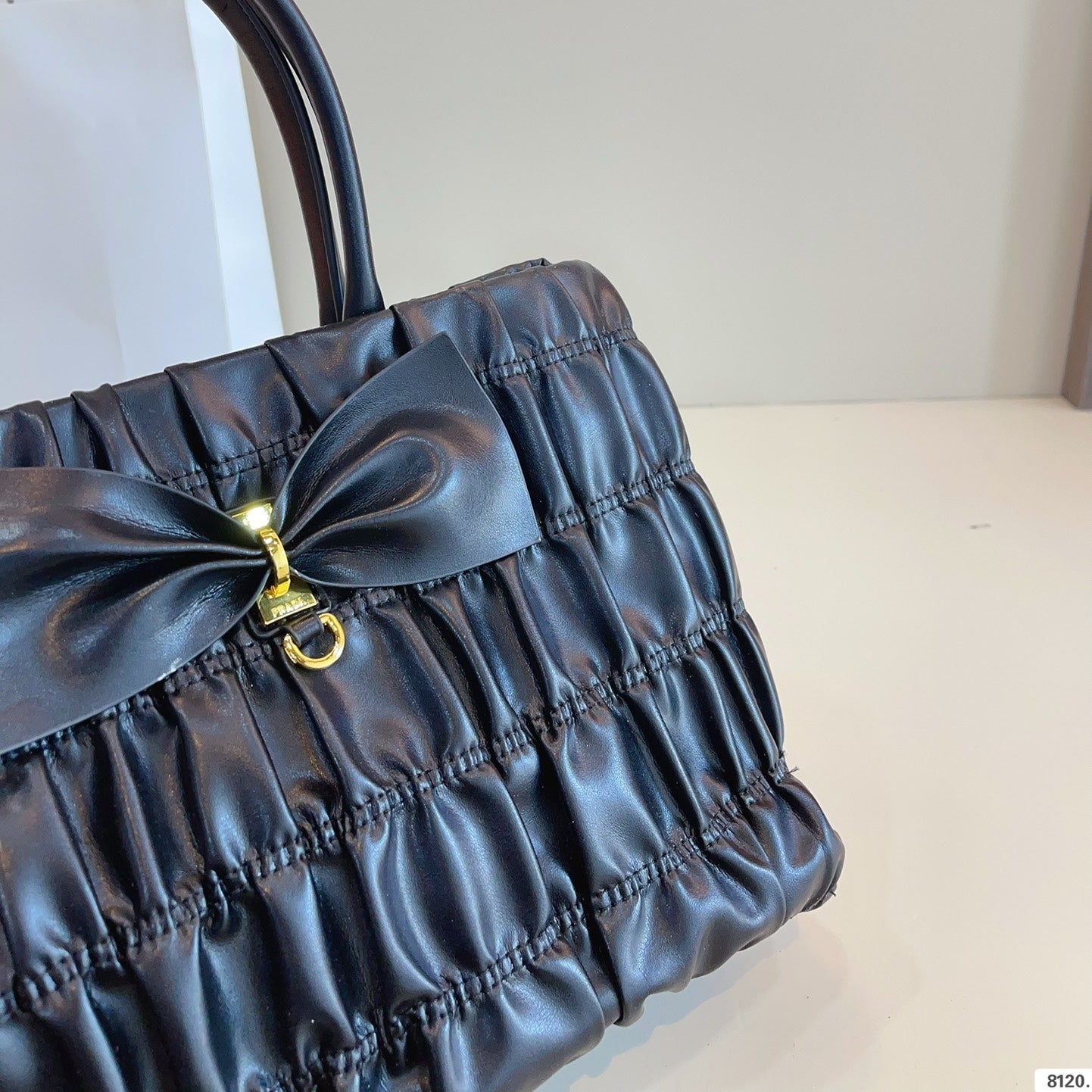 BOW DETAIL RUCHED TOP HANDLE BAG 29 IN BLACK SAFFIANO LEATHER