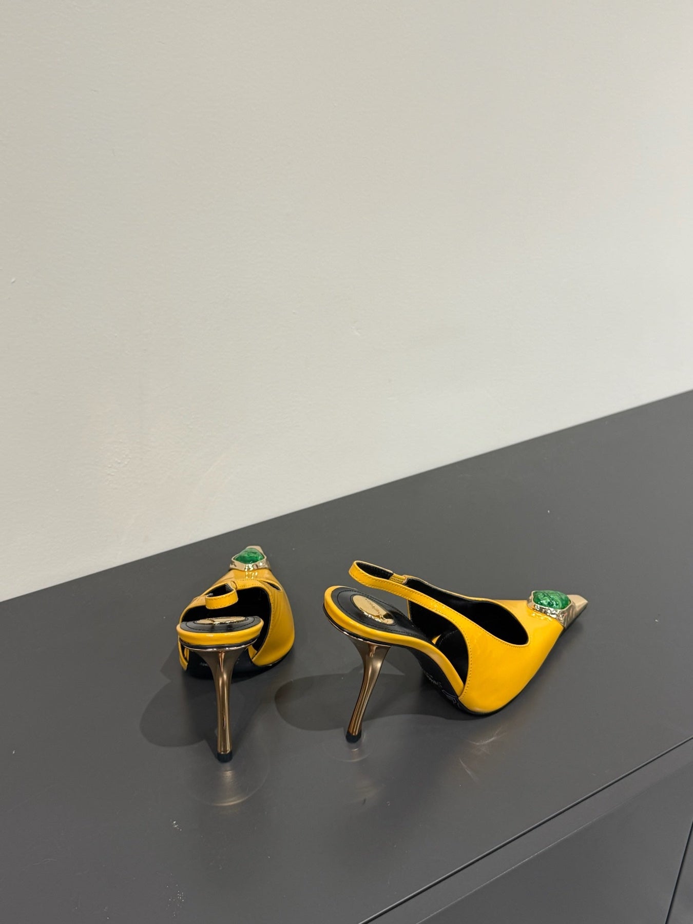 GREEN GEM-STUDDED SLINGBACK PUMPS IN YELLOW PATENT CALFSKIN