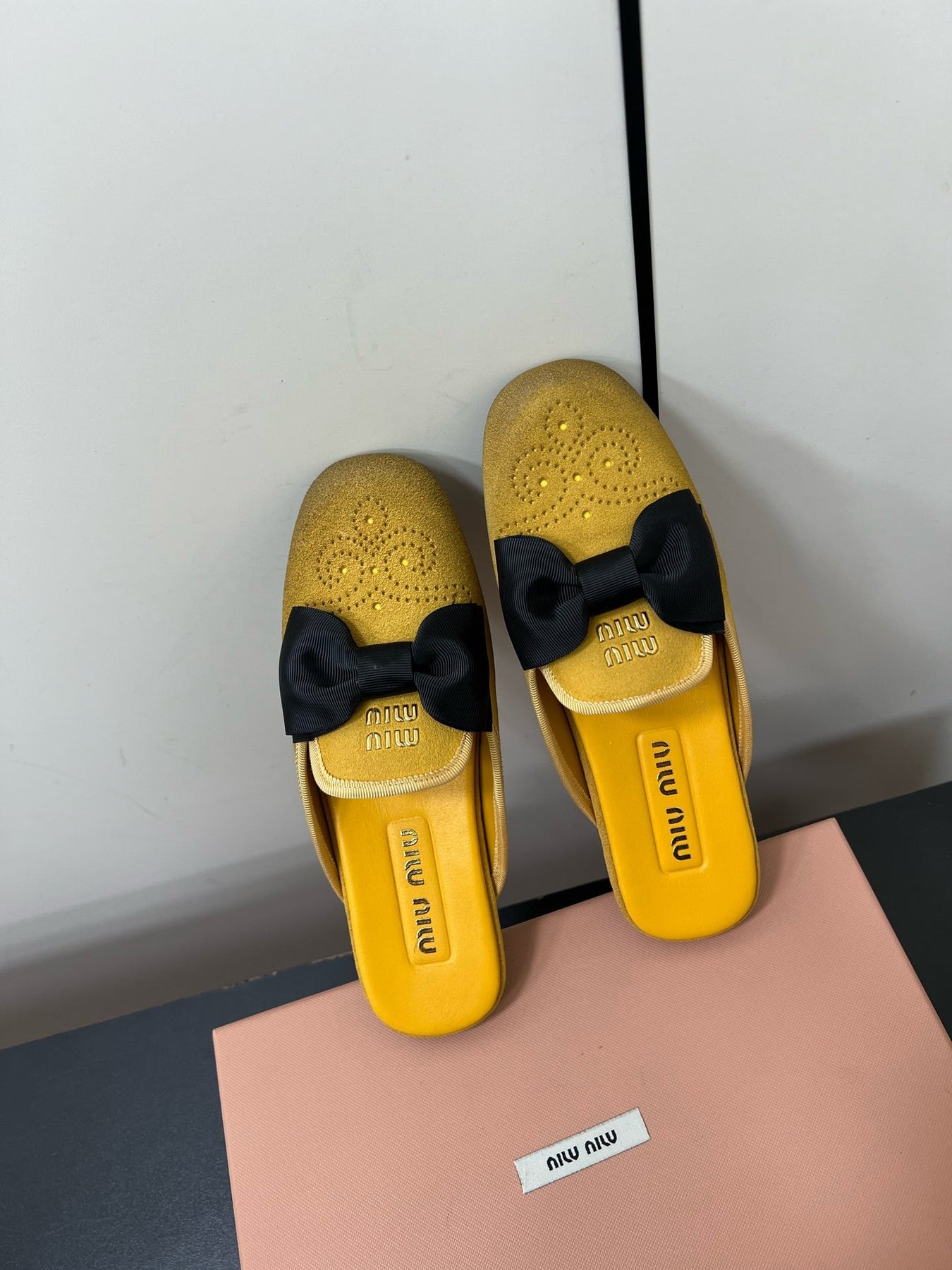 BOW MULES IN DUST YELLOW SUEDE
