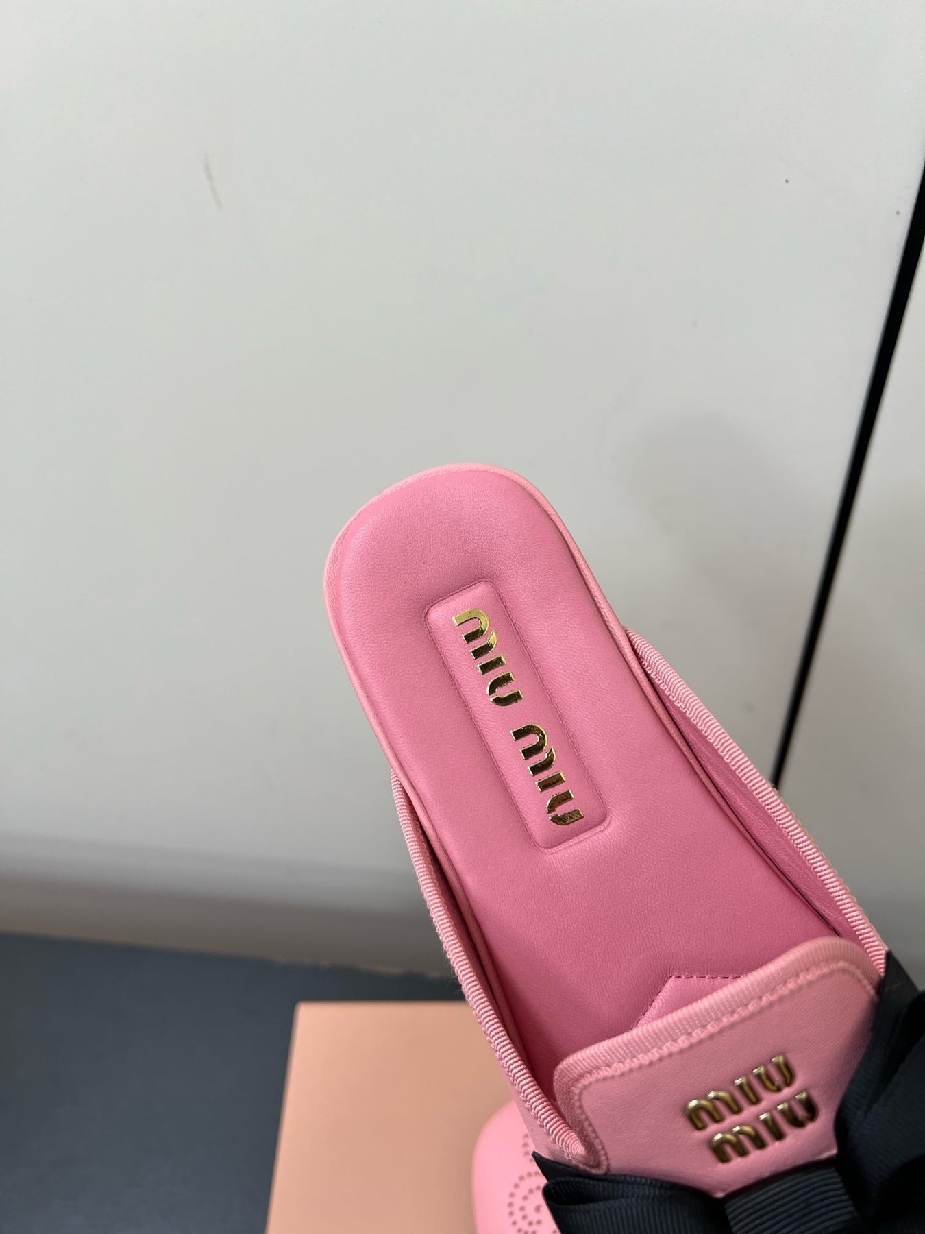 BOW MULES IN PINK SHEEPSKIN