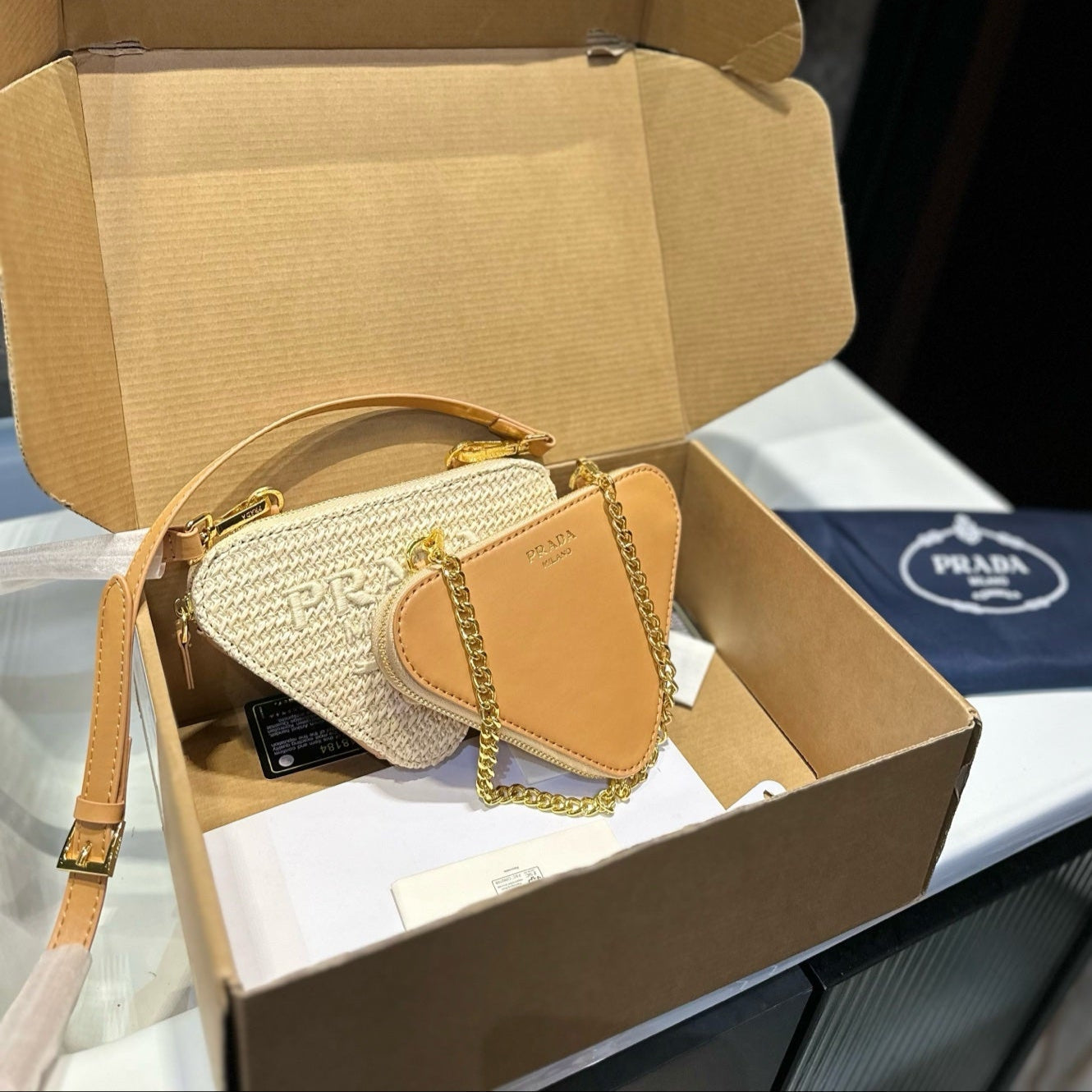 EMBROIDED LOGO TRIANGLE BAG 18 IN BEIGE WOVEN RAFFIA GOLD CHAIN