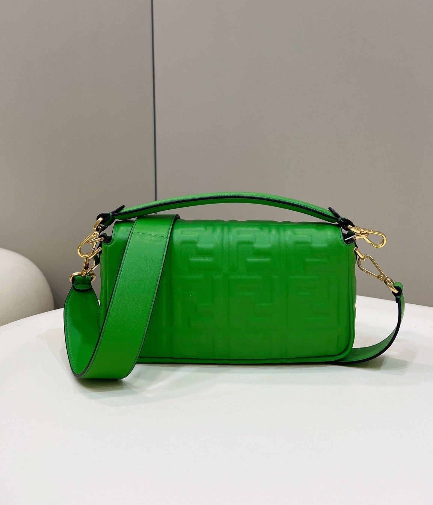 BAGUETTE WITH FF MOTIF 27 IN EMERALD GREEN SOFT LAMBSKIN GOLD HARDWARE