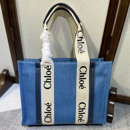 MEDIUM STRAP WOODY TOTE BAG 37 IN BLUE DENIM CANVAS DARK BLUE CALFSKIN