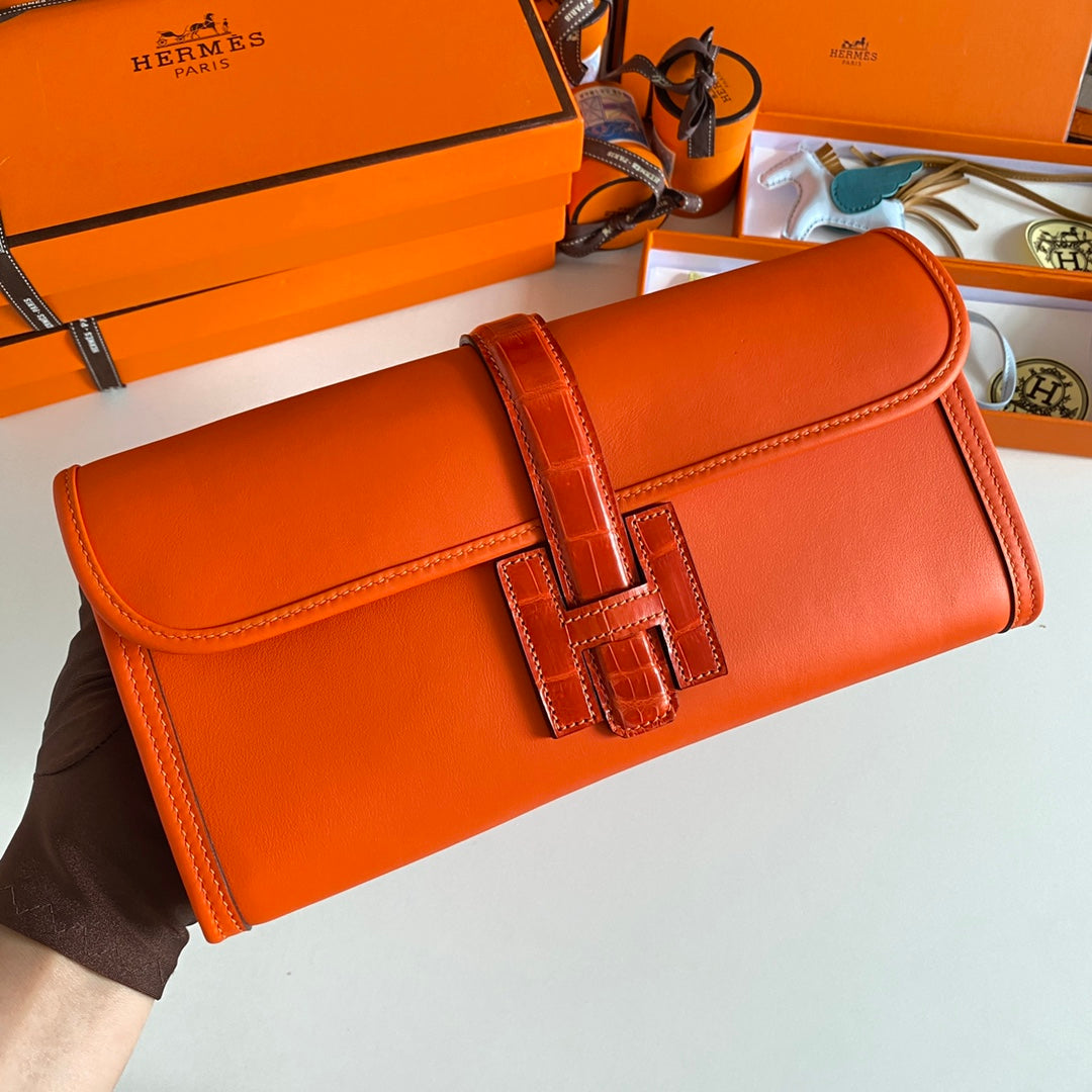 JIGE ELAN 29 CLUTCH IN BRIGHT ORANGE CALFSKIN WITH LIZARD SKIN