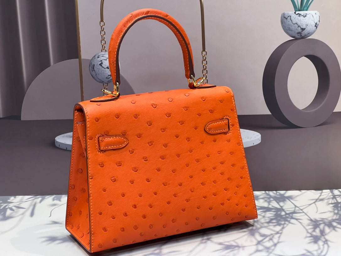 KELLY BAG 20 IN FIRE ORANGE OSTRICH LEATHER WITH GOLD HARDWARE