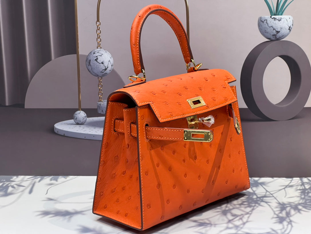 KELLY BAG 20 IN FIRE ORANGE OSTRICH LEATHER WITH GOLD HARDWARE