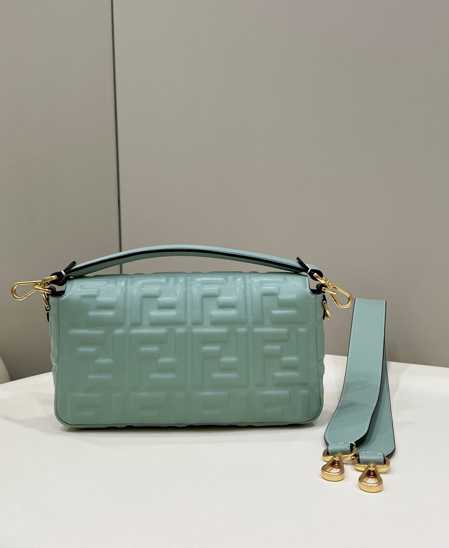 BAGUETTE WITH FF MOTIF 27 IN VIRIDIAN GREEN SOFT LAMBSKIN GOLD HARDWARE