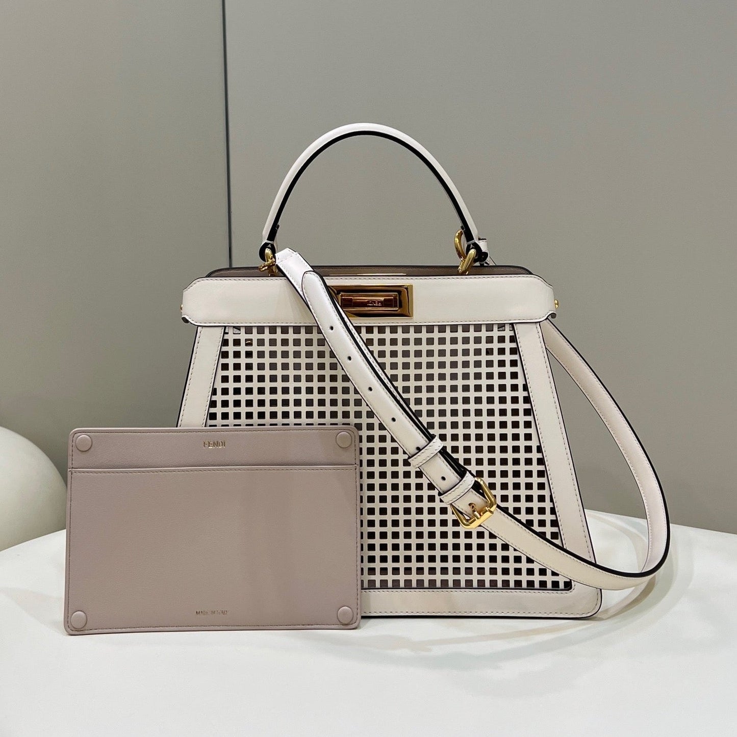PEEKABOO ISEEU 34 IN WHITE PERFORATED CALFSKIN GOLD HARDWARE