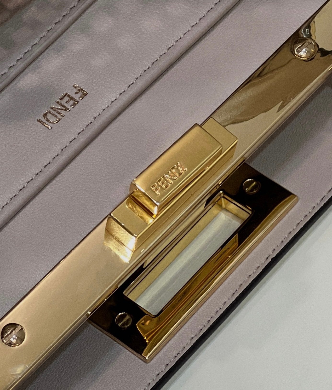 PEEKABOO ISEEU 34 IN WHITE PERFORATED CALFSKIN GOLD HARDWARE