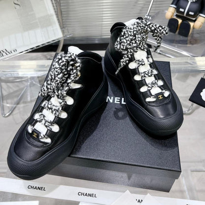 CC CANO ALTO SNEAKER IN BLACK CALFSKIN AND RUBBER