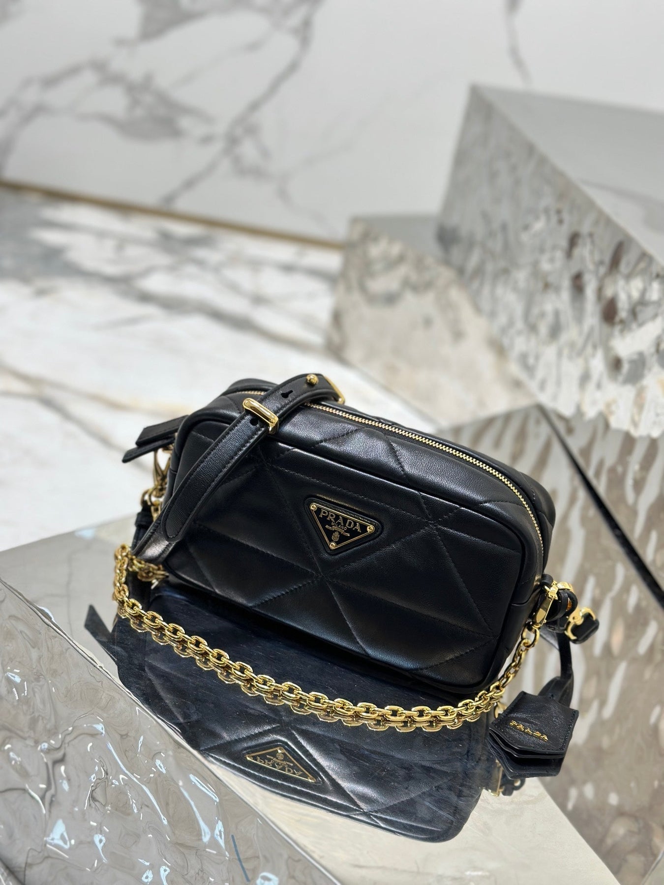 CAMERA BAG 22 IN BLACK TRIANGLE PATTERN QUILTED LAMBSKIN GOLD HARDWARE