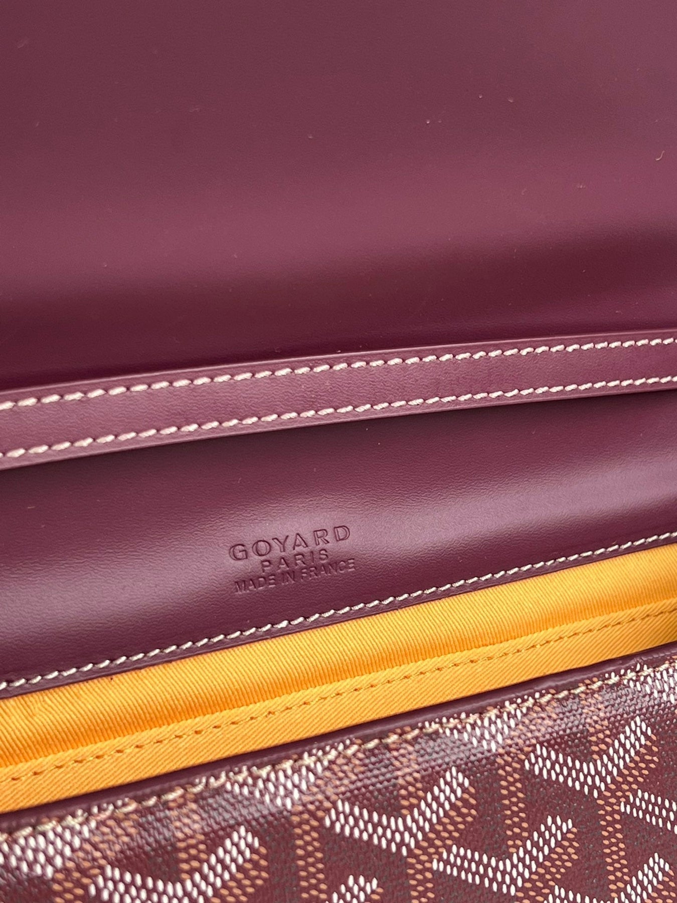 MONTE-CARLO PM CLUTCH 25 IN WINE RED GOYARDINE CANVAS