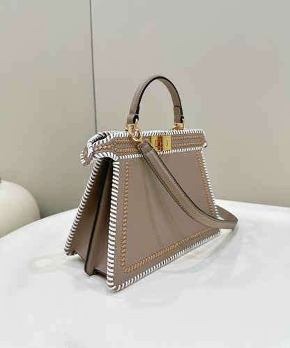 PEEKABOO ISEEU 27 IN MEDIUM BROWN INTERLACED CALFSKIN GOLD HARDWARE