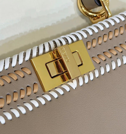 PEEKABOO ISEEU 27 IN MEDIUM BROWN INTERLACED CALFSKIN GOLD HARDWARE