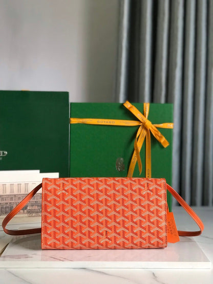 MONTE-CARLO PM CLUTCH 25 IN ORANGE GOYARDINE CANVAS