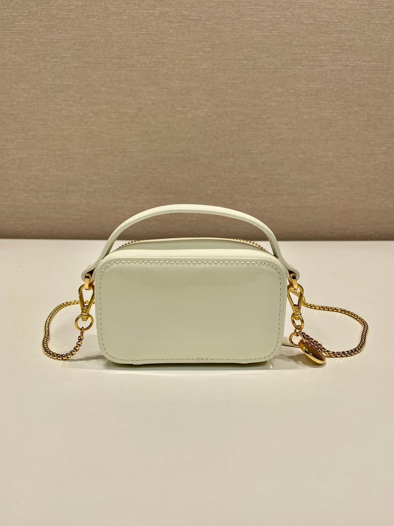 MINI HAND BAG 11 WITH GOLD STRAP IN WHITE PATENT CALFSKIN