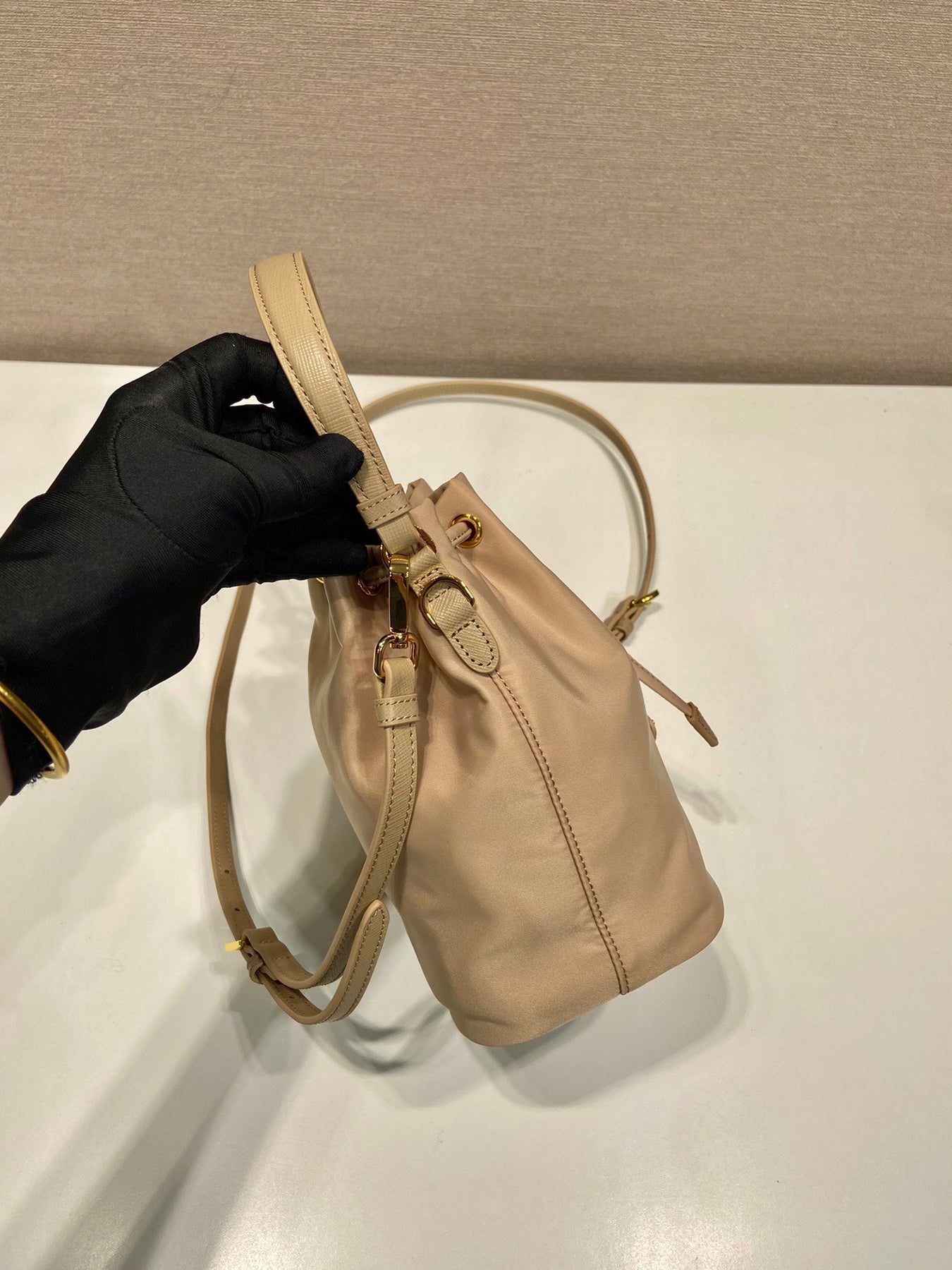 BUCKET BAG 19 IN BEIGE RE-NYLON AND SAFFIANO LEATHER HANDLE