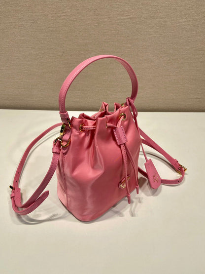 BUCKET BAG 19 IN CANDY PINK RE-NYLON AND SAFFIANO LEATHER HANDLE