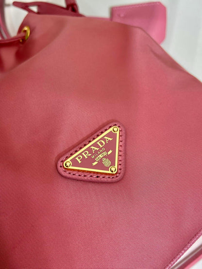 BUCKET BAG 19 IN CANDY PINK RE-NYLON AND SAFFIANO LEATHER HANDLE