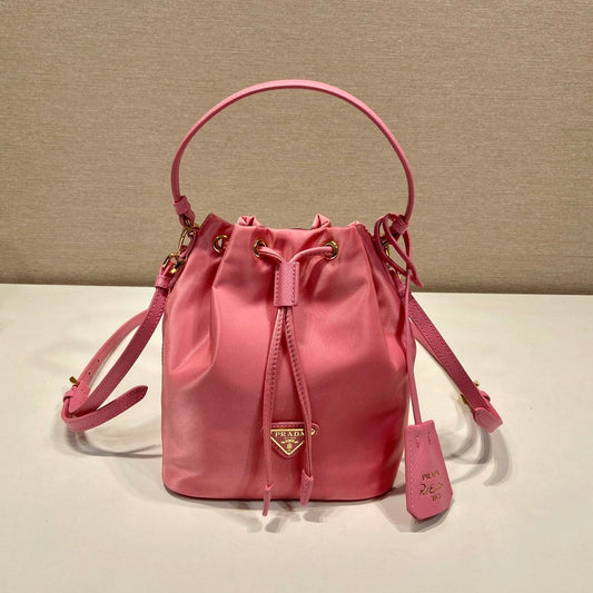 BUCKET BAG 19 IN CANDY PINK RE-NYLON AND SAFFIANO LEATHER HANDLE