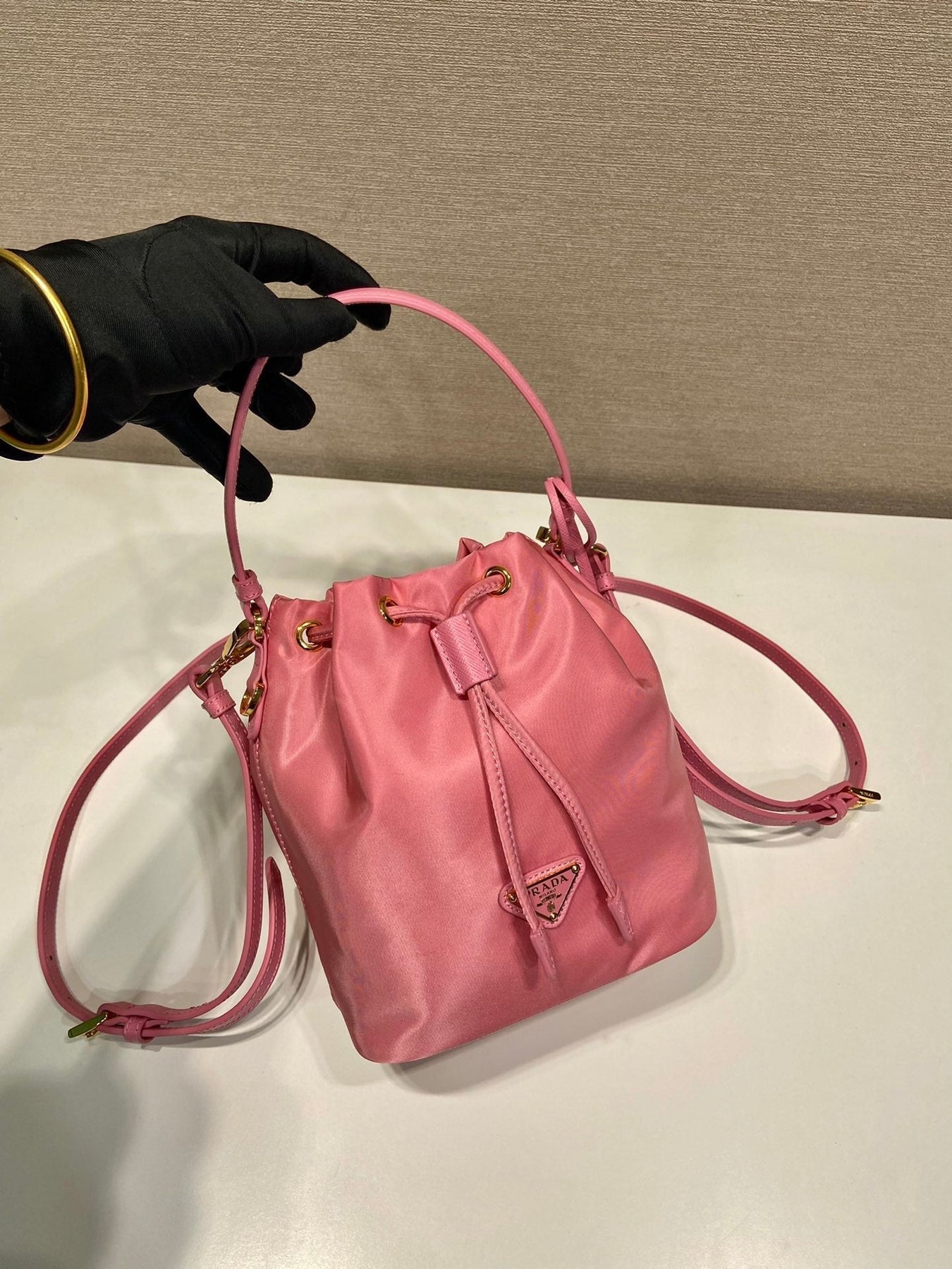 BUCKET BAG 19 IN CANDY PINK RE-NYLON AND SAFFIANO LEATHER HANDLE
