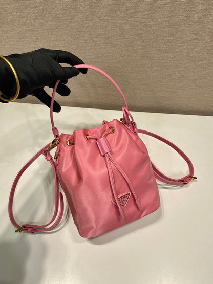 BUCKET BAG 19 IN CANDY PINK RE-NYLON AND SAFFIANO LEATHER HANDLE