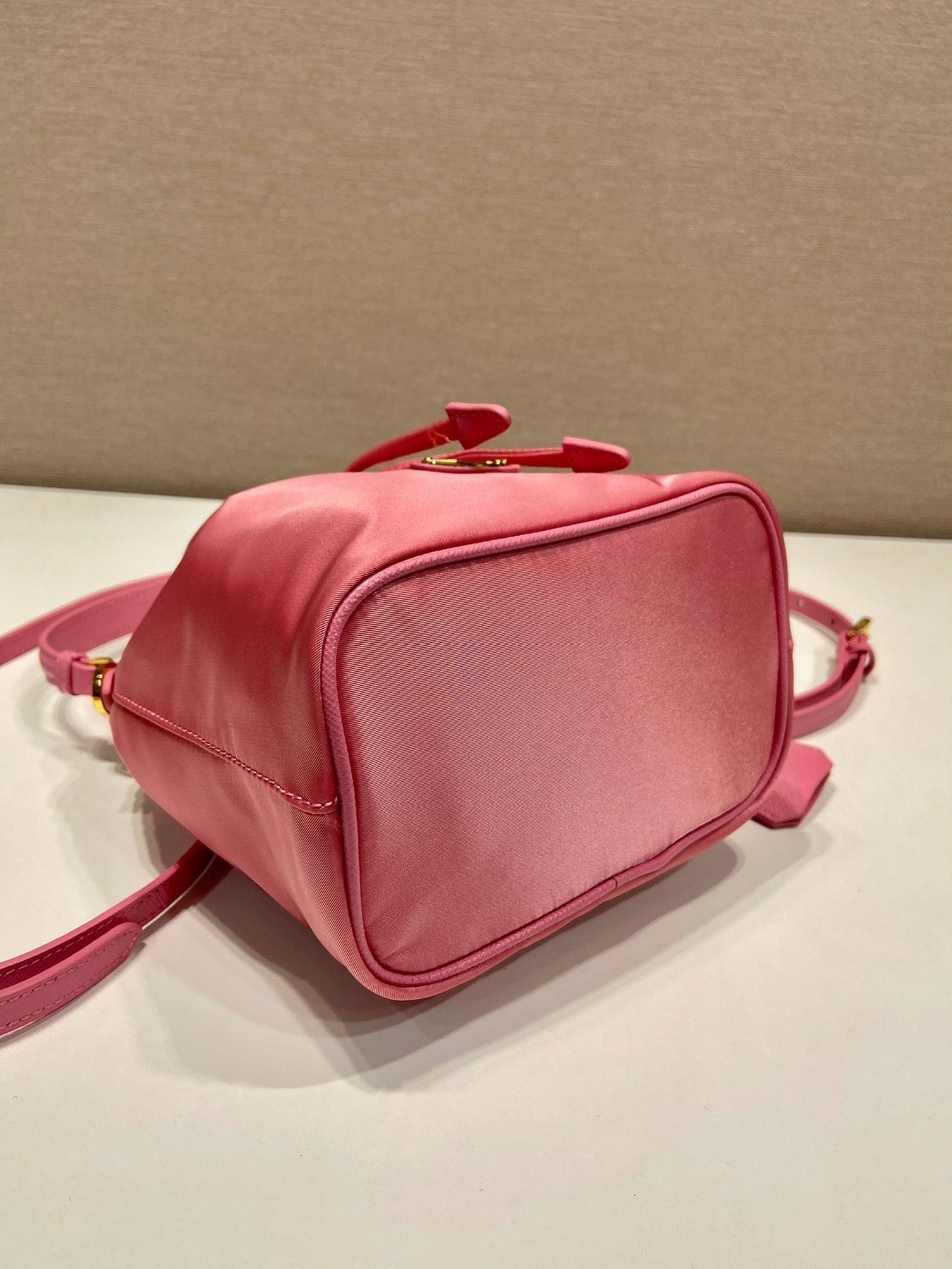 BUCKET BAG 19 IN CANDY PINK RE-NYLON AND SAFFIANO LEATHER HANDLE