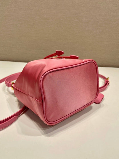 BUCKET BAG 19 IN CANDY PINK RE-NYLON AND SAFFIANO LEATHER HANDLE