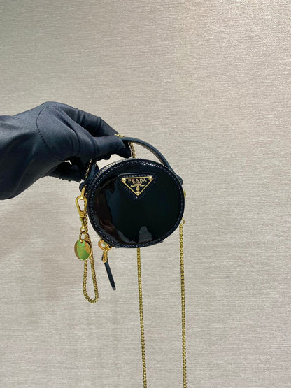 MINI ROUND BAG 8 IN BLACK GLOSSY CALFSKIN GOLD HARDWARE