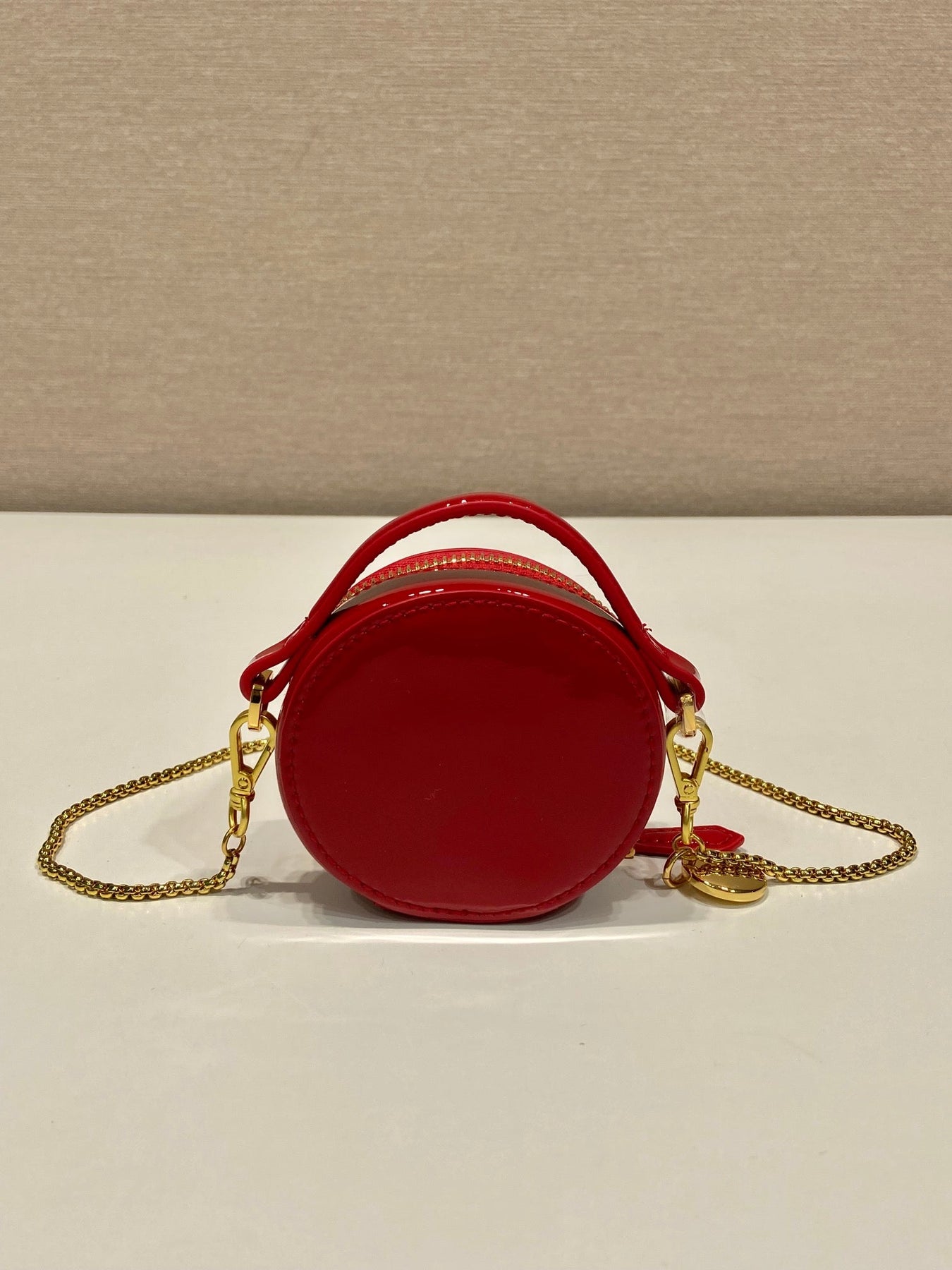 MINI ROUND BAG 8 IN RED GLOSSY CALFSKIN GOLD HARDWARE