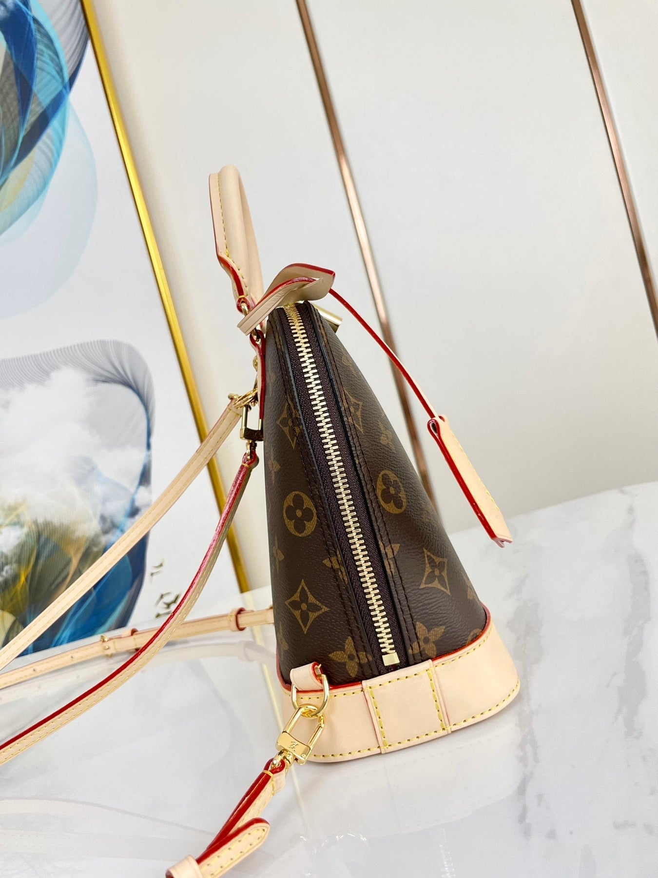 ALMA BACKPACK 20 IN BROWN MONOGRAM CANVAS AND BEIGE CALFSKIN TRIM GOLD BUCKLE