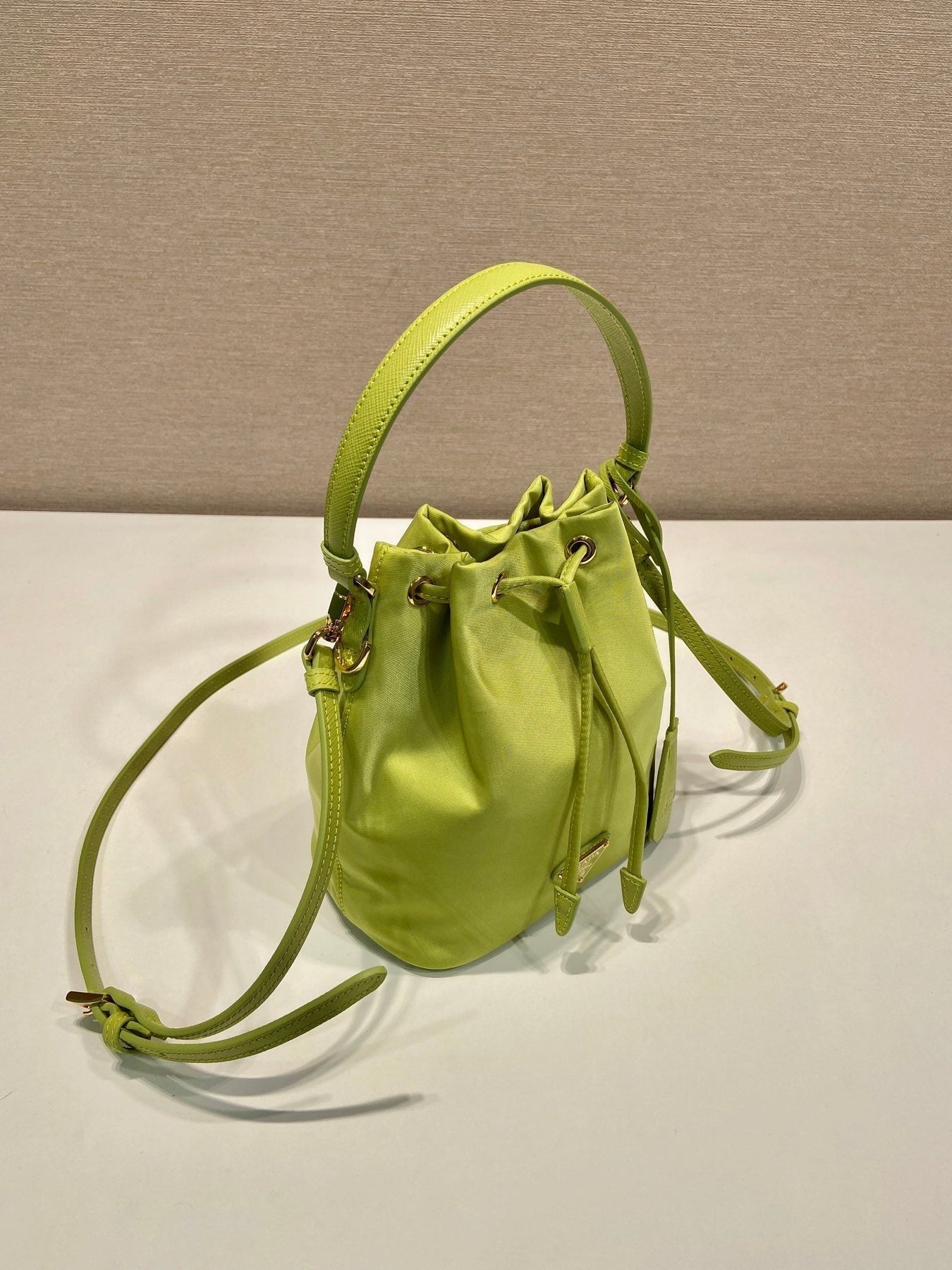 BUCKET BAG 19 IN APPLE GREEN RE-NYLON AND SAFFIANO LEATHER HANDLE