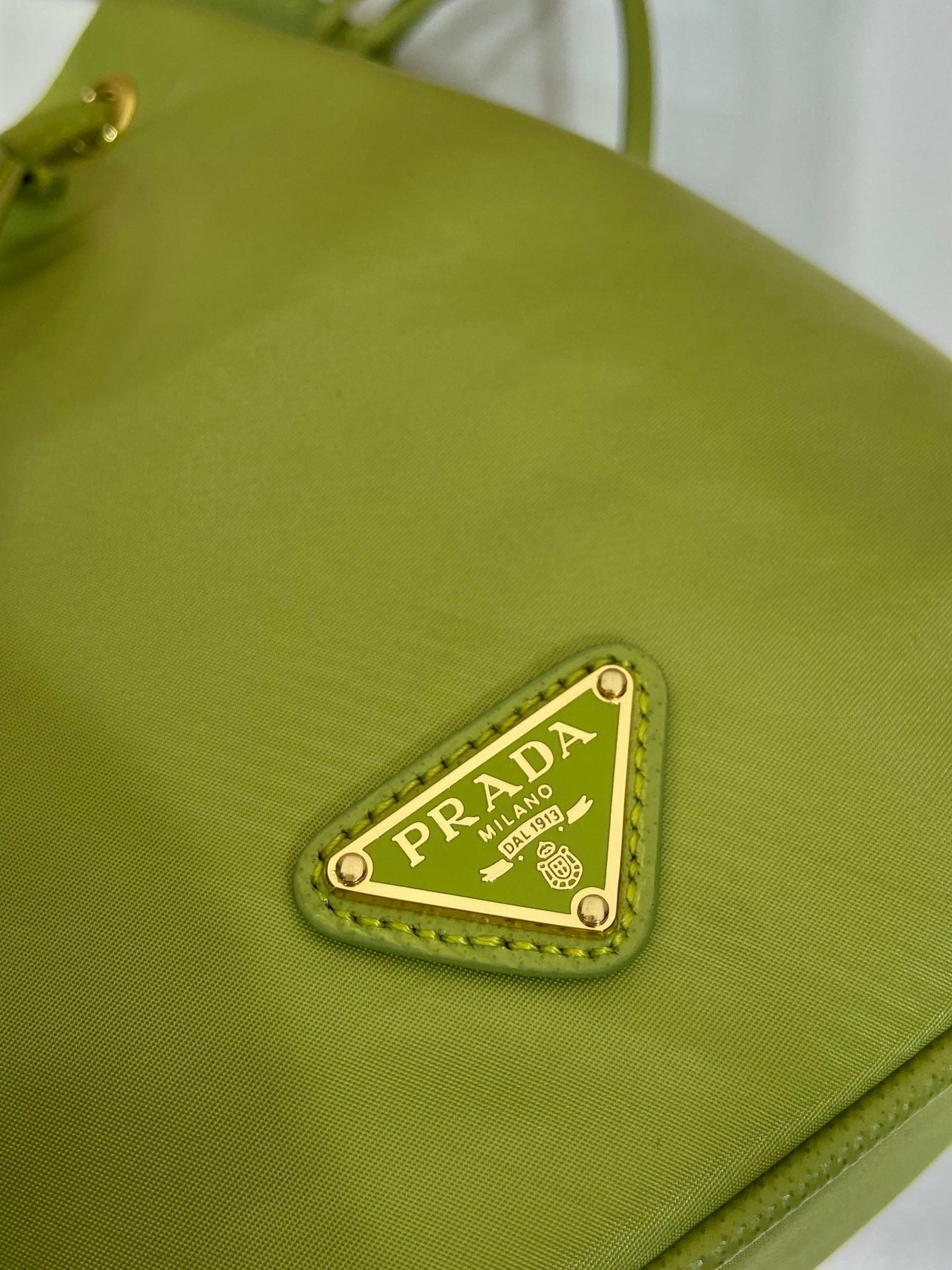 BUCKET BAG 19 IN APPLE GREEN RE-NYLON AND SAFFIANO LEATHER HANDLE