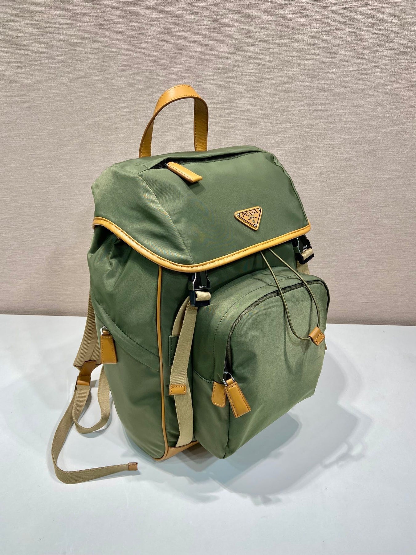 BACKPACK 45 IN SEAWEED GREEN RE-NYLON AND BROWN CALFSKIN TRIM