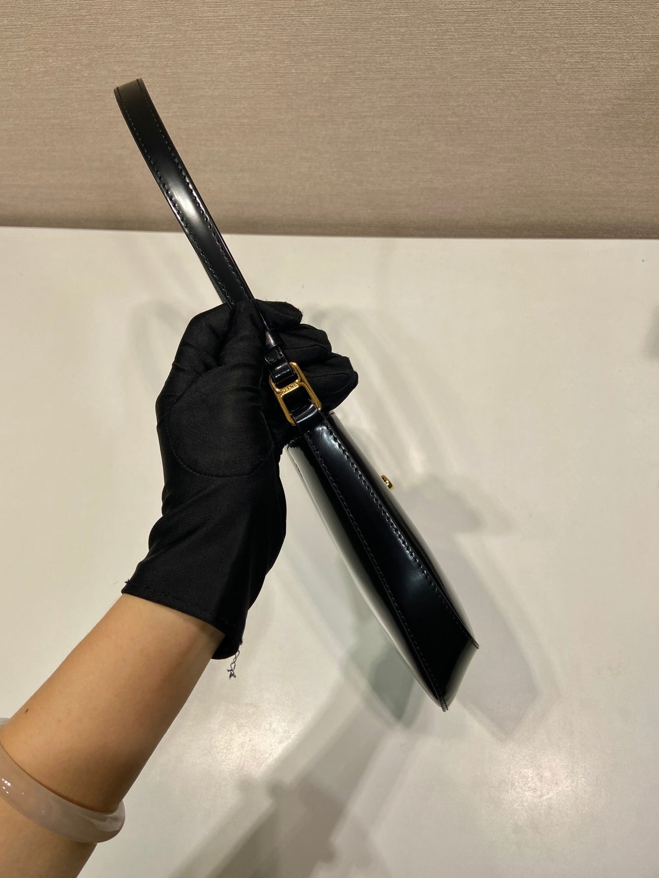 CLEO SHOULDER BAG 22 IN BLACK BRUSHED LAMBSKIN WITH CLASP CLOSURE