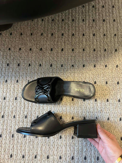 CLEMENCE MULE IN BLACK LAMBSKIN AND PATENT CALFSKIN