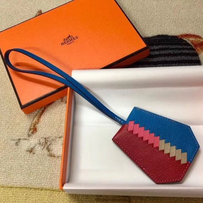 HERM Clochette Cles Grand Tressage Charm In Ruby/Blue