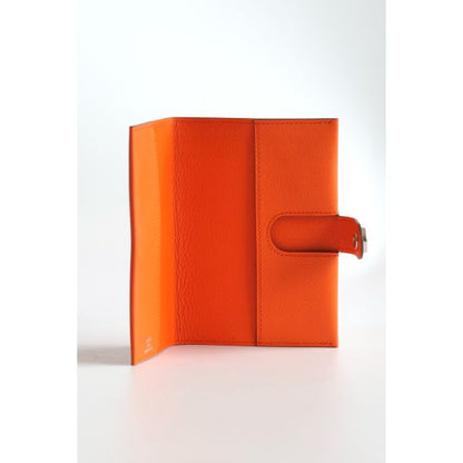 HERM R.M.S Passport Holder in Orange Evercolor Calfskin