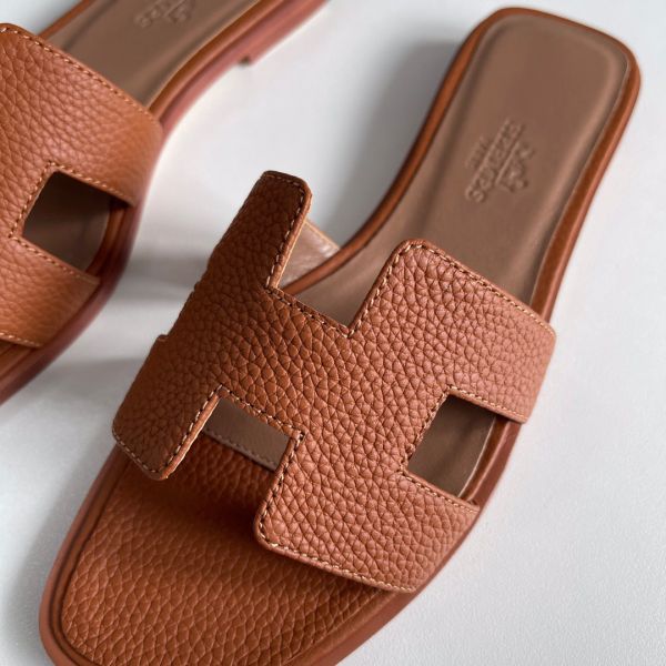 HERM Oran Slide Sandals In Gold Clemence Leather