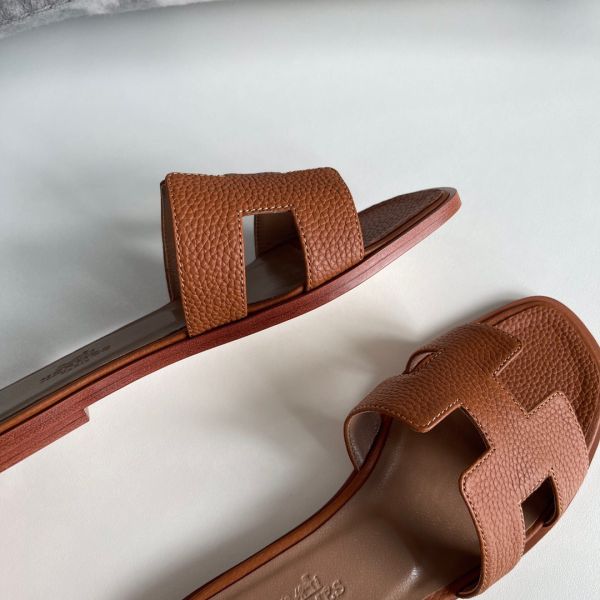 HERM Oran Slide Sandals In Gold Clemence Leather