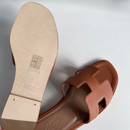 HERM Oran Slide Sandals In Gold Clemence Leather