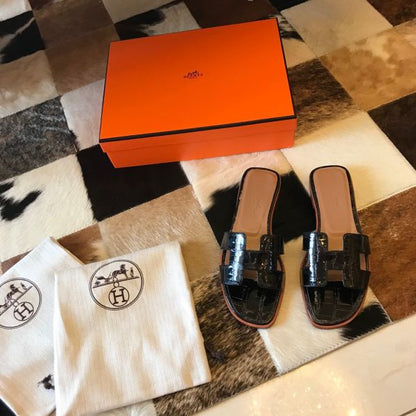 HERM Oran Slide Sandals In Black Shiny Niloticus Crocodile Skin