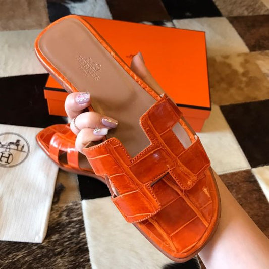 HERM Oran Slide Sandals In Orange Shiny Niloticus Crocodile Skin