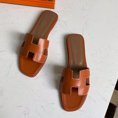 HERM Oran Slide Sandals In Gold Swift Calfskin